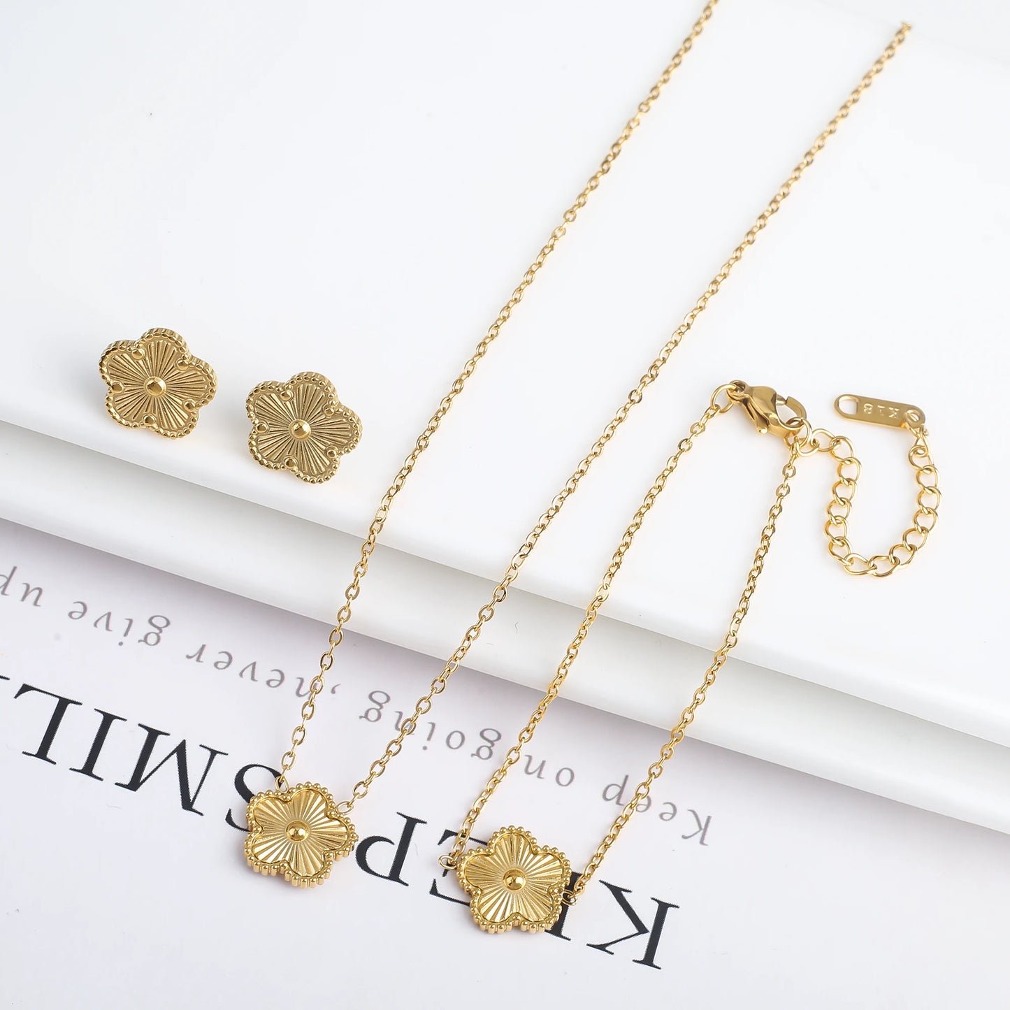 Luxury Stainless Steel Five Leaf Flower Jewelry Set for Women Featuring Bracelet Necklace Earrings and Rings