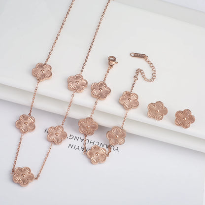 Luxury Stainless Steel Five Leaf Flower Jewelry Set for Women Featuring Bracelet Necklace Earrings and Rings
