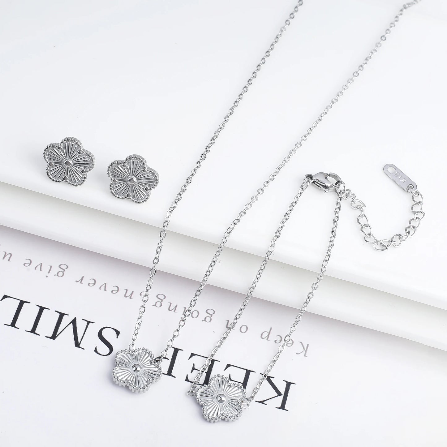 Luxury Stainless Steel Five Leaf Flower Jewelry Set for Women Featuring Bracelet Necklace Earrings and Rings